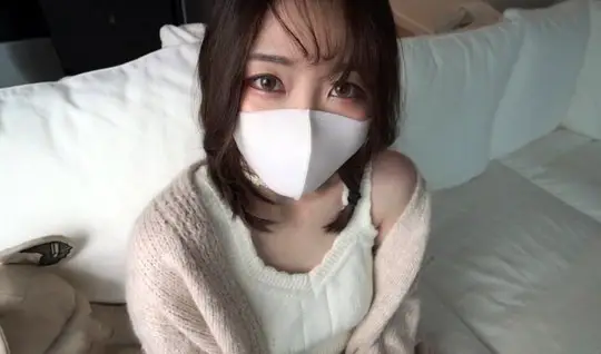 Masked Asian girl spreads her legs for homemade porn with a fan in the...