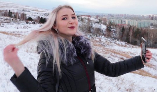Russian girl in winter in nature sucks off her lover's plump penis