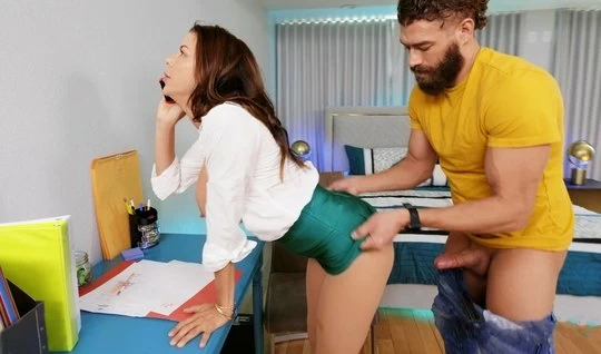 A bearded man in the office fucks a mom boss doggystyle deep in her pussy